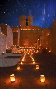 Adobe with lanterns and night sky